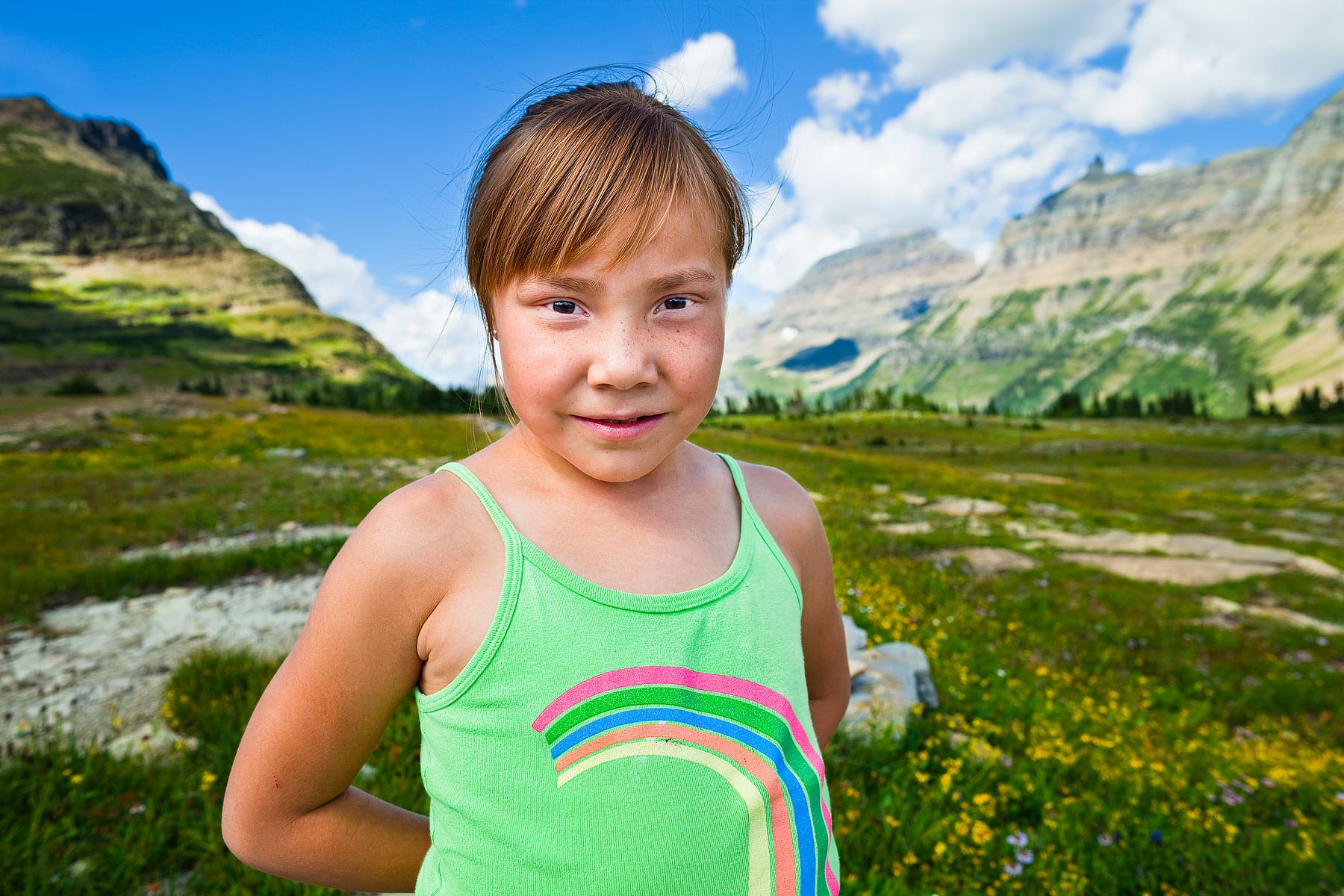 Annie Whitney (age 6), stands at Logan Pass on the Going to the Sun Highway during a field trip to Glacier National Park with the Browning Boys & Girls Club. Before it became a national park, this land belonged to the Blackfeet Tribe.


