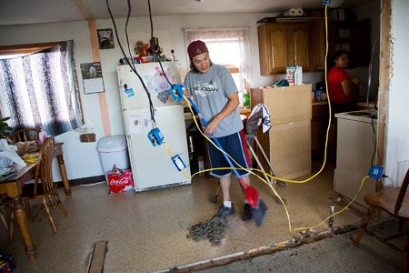Shaw works to upgrade their transplanted house by replacing the original electric wiring
