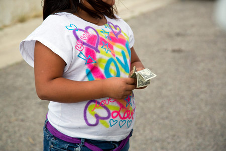 A Kool Breeze customer counts her money