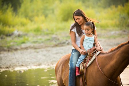 Kendall Edmo with her boyfriend, Andrew and her 2 year old daughter at her family home in Two Medicine on the Blackfeet Reservation. 