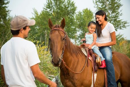 Kendall Edmo with her boyfriend, Andrew and her 2 year old daughter at her family home in Two Medicine on the Blackfeet Reservation. 